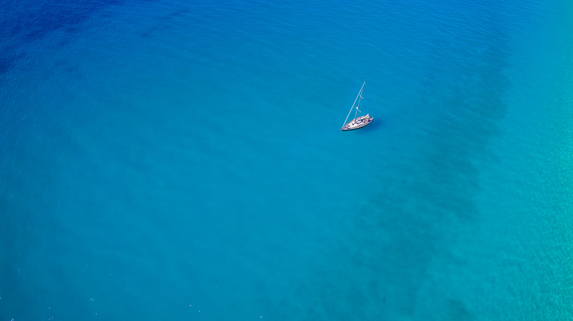 Kathisma beach aerial view of a yacht in the sea